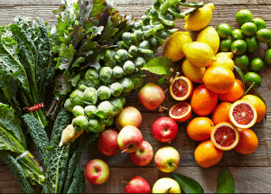 a group of fruits and vegetables on a wood surface Healthy Weight Loss Diets Dunstable